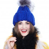 The knitted hat with a pompon The knitted hat with a pompon