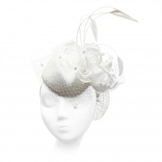 Velour pillbox hat with a feather flower and a veil