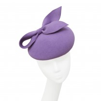 Asymmetrical pill-box hat with a bow