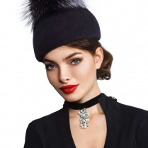 A felt beret with a pompon